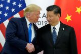 Usmívat se a zůstat v klidu. Trump zmírnil protičínskou rétoriku, Peking se toho pokusí využít